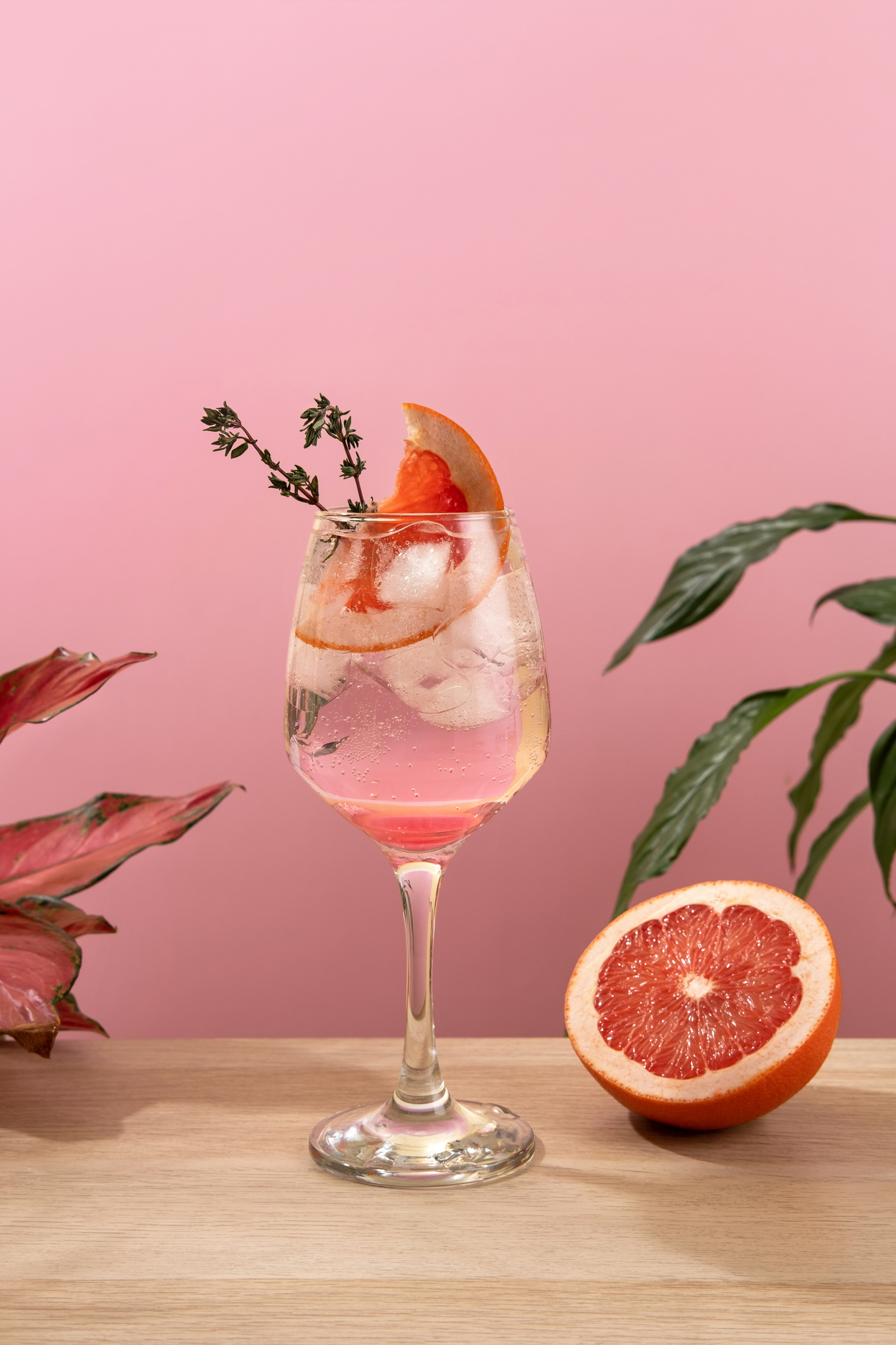 Mocktail Paloma. Refreshing grapefruit cocktail with ice and thyme. Cocktail of fresh pink Paloma